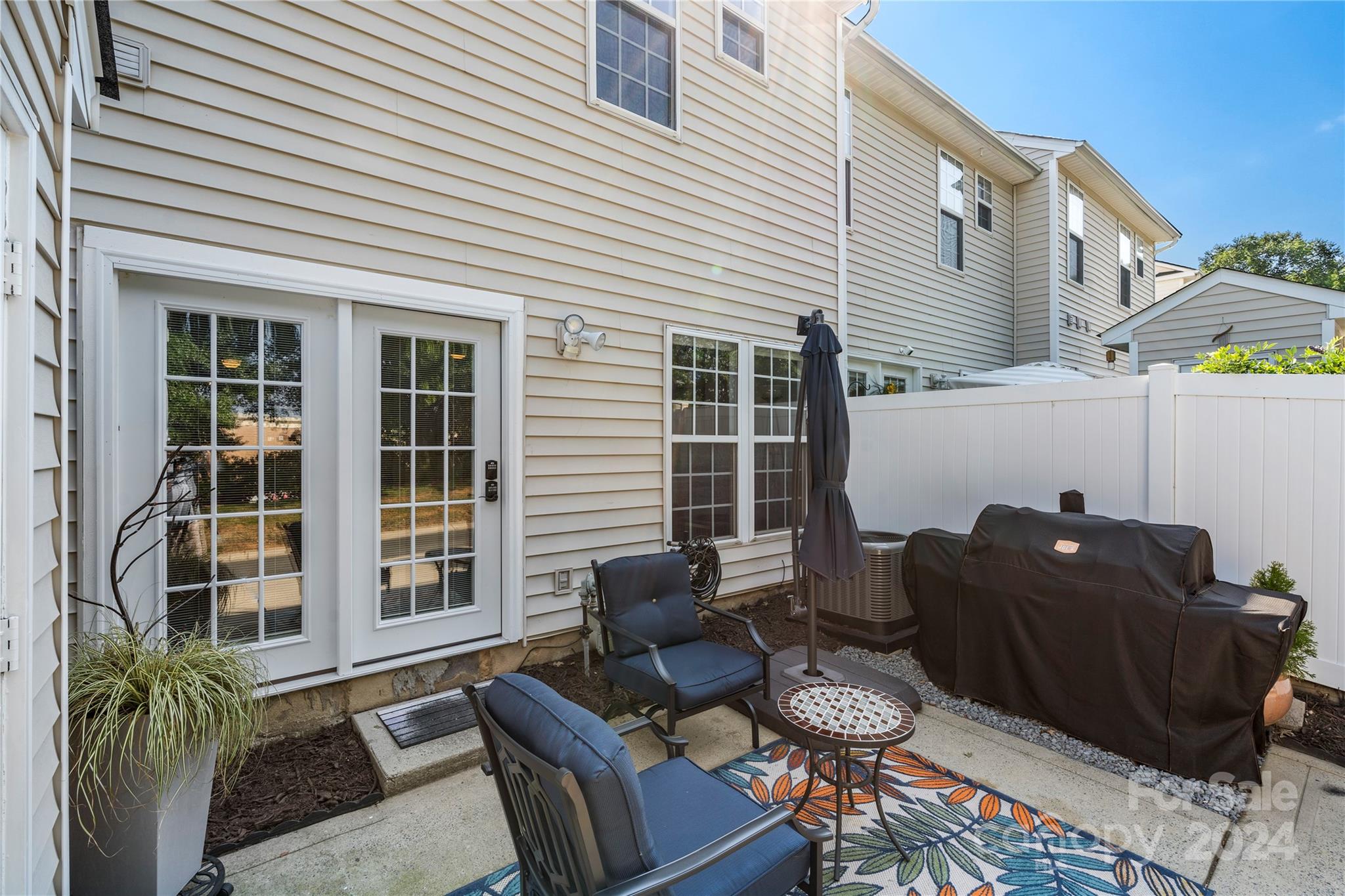 621 Atherton Way Rock Hill, SC 29730 - Photo 26 of 33 a view of a patio with couches and a potted plant on a table