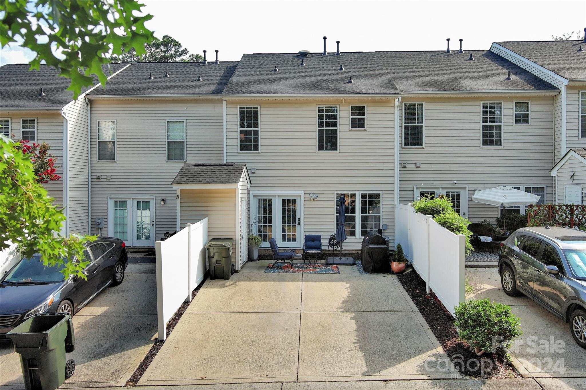 621 Atherton Way Rock Hill, SC 29730 - Photo 28 of 33 a view of a white house with a chairs in patio