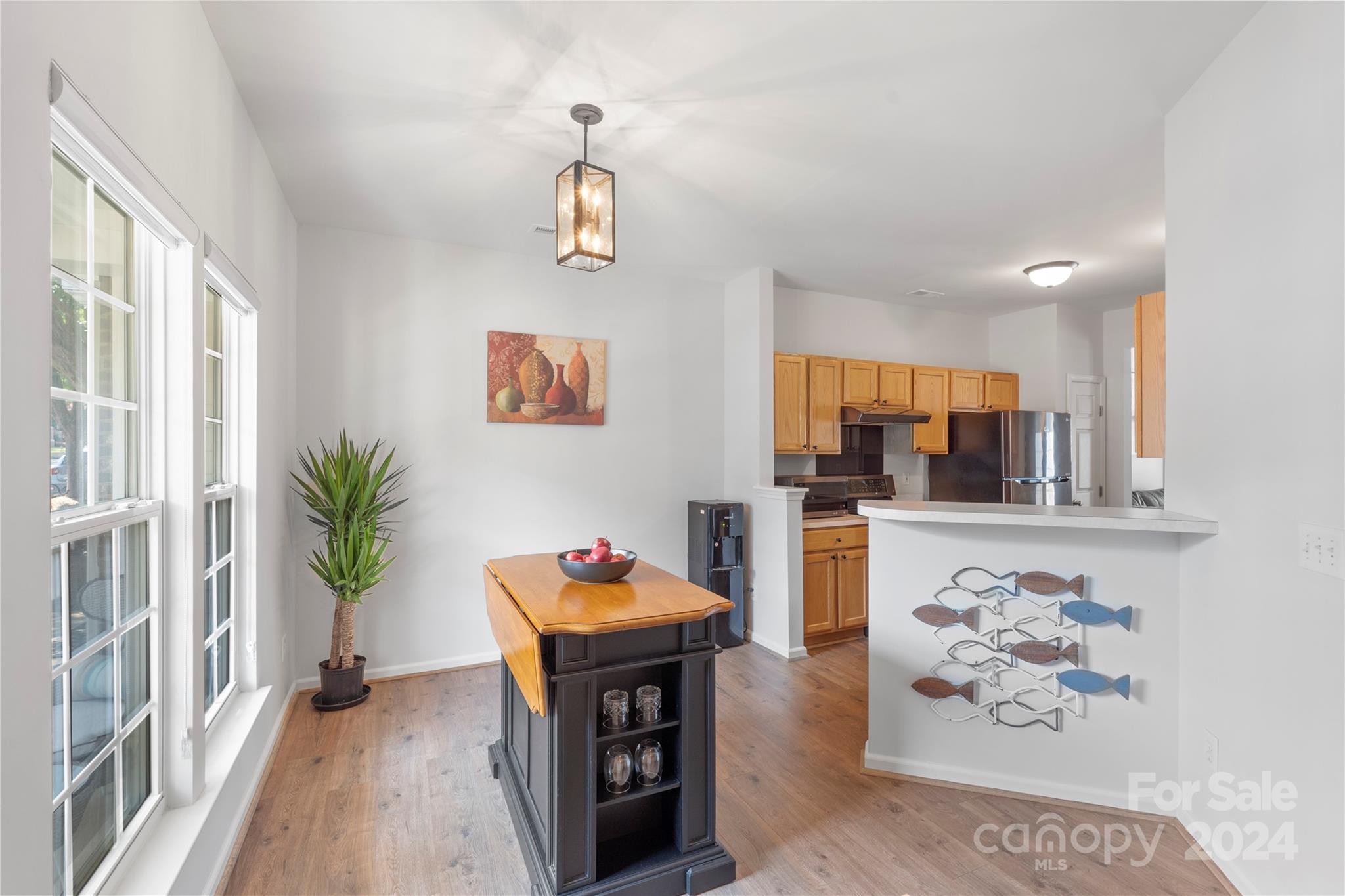 621 Atherton Way Rock Hill, SC 29730 - Photo 7 of 33 a living room with furniture a dining table and a potted plant