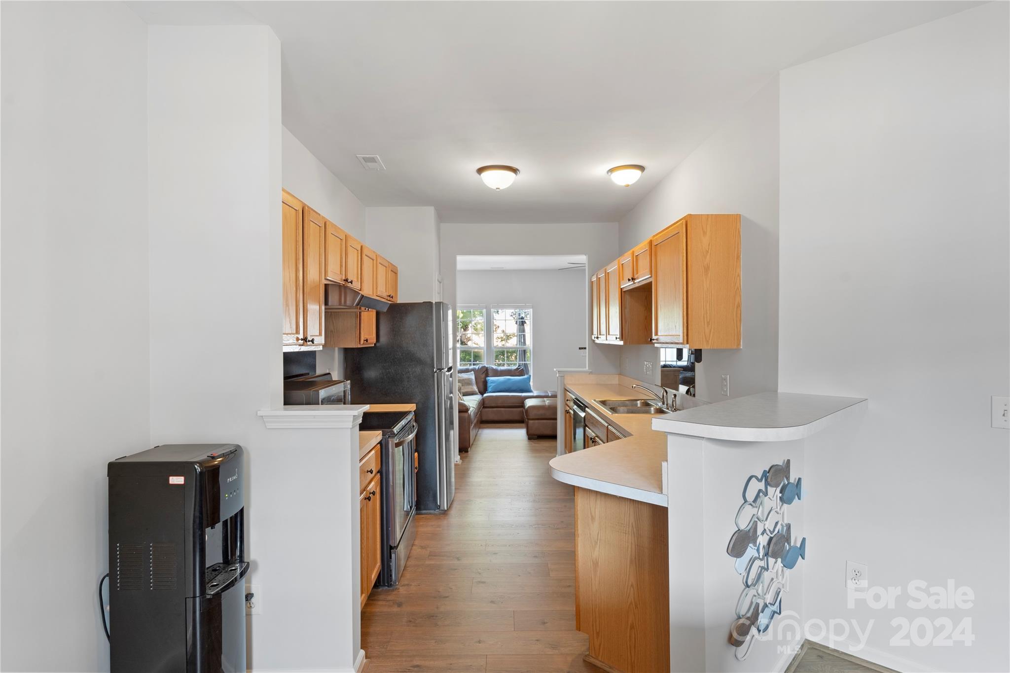 621 Atherton Way Rock Hill, SC 29730 - Photo 10 of 33 a view of a kitchen with kitchen island stainless steel appliances refrigerator stove microwave and cabinets