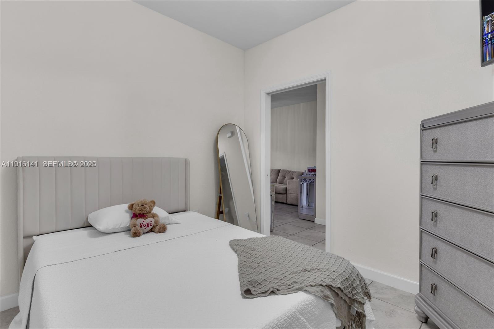 11413 Southwest 252nd Terrace Homestead, FL 33032 - Photo 20 of 40 a bedroom with a bed and a large mirror