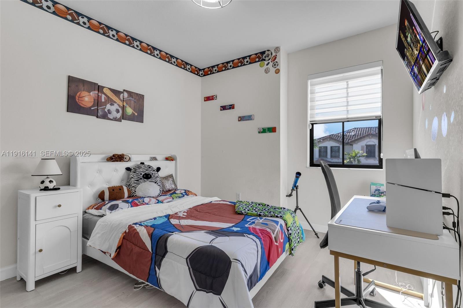 11413 Southwest 252nd Terrace Homestead, FL 33032 - Photo 21 of 40 a bedroom with a bed and a table