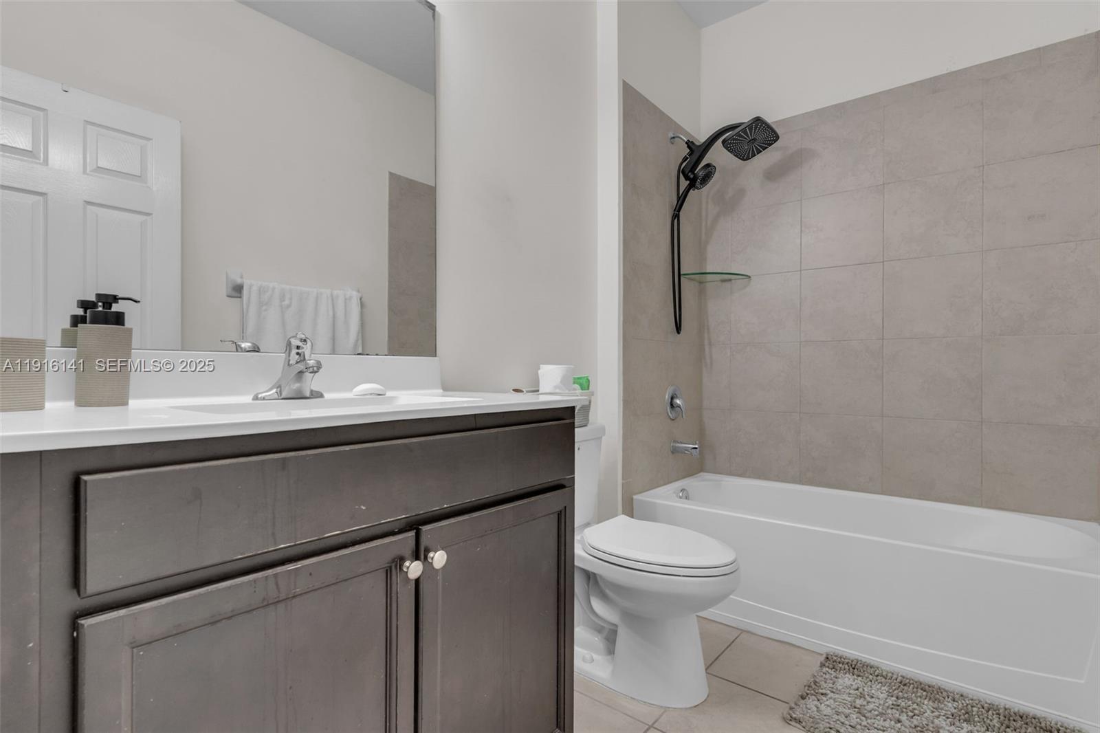 11413 Southwest 252nd Terrace Homestead, FL 33032 - Photo 25 of 40 a bathroom with a sink a toilet and a bathtub