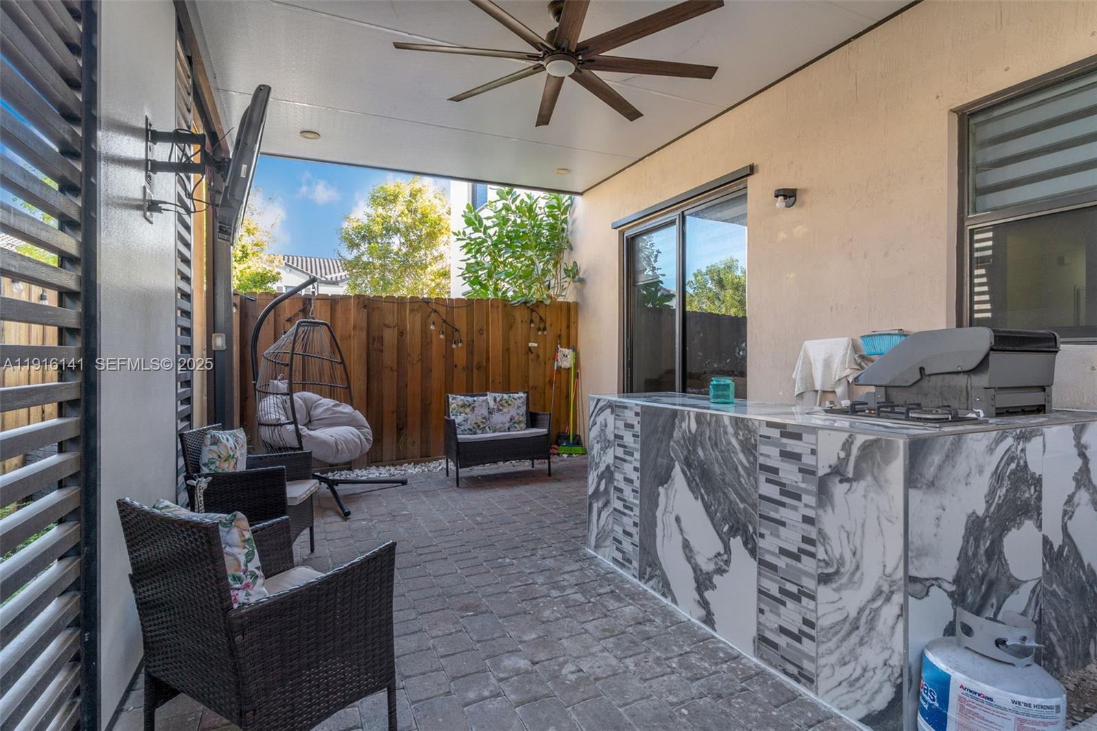 11413 Southwest 252nd Terrace Homestead, FL 33032 - Photo 28 of 40 a living room with furniture and a large window