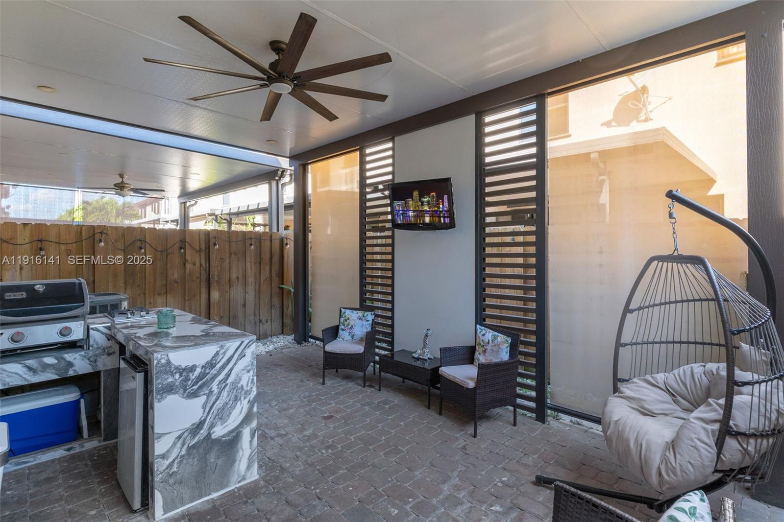 11413 Southwest 252nd Terrace Homestead, FL 33032 - Photo 29 of 40 a living room with furniture a rug and a large window