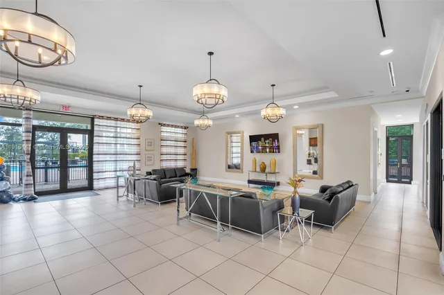 a large room with lots of furniture and a large window