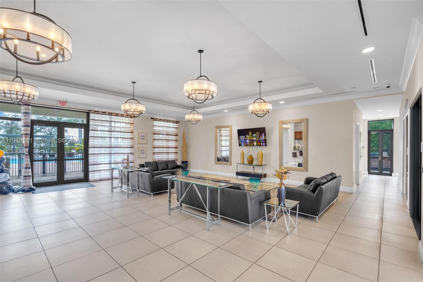 11413 Southwest 252nd Terrace Homestead, FL 33032 - Photo 30 of 40 a large room with lots of furniture and a large window