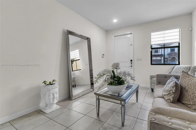 a living room with furniture and window