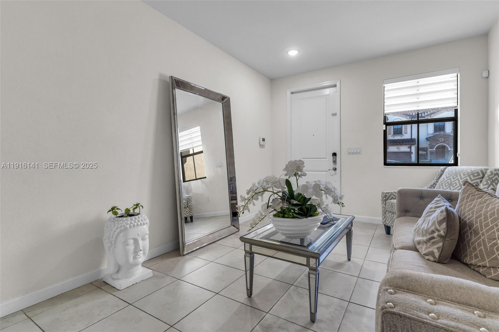 11413 Southwest 252nd Terrace Homestead, FL 33032 - Photo 4 of 40 a living room with furniture and window