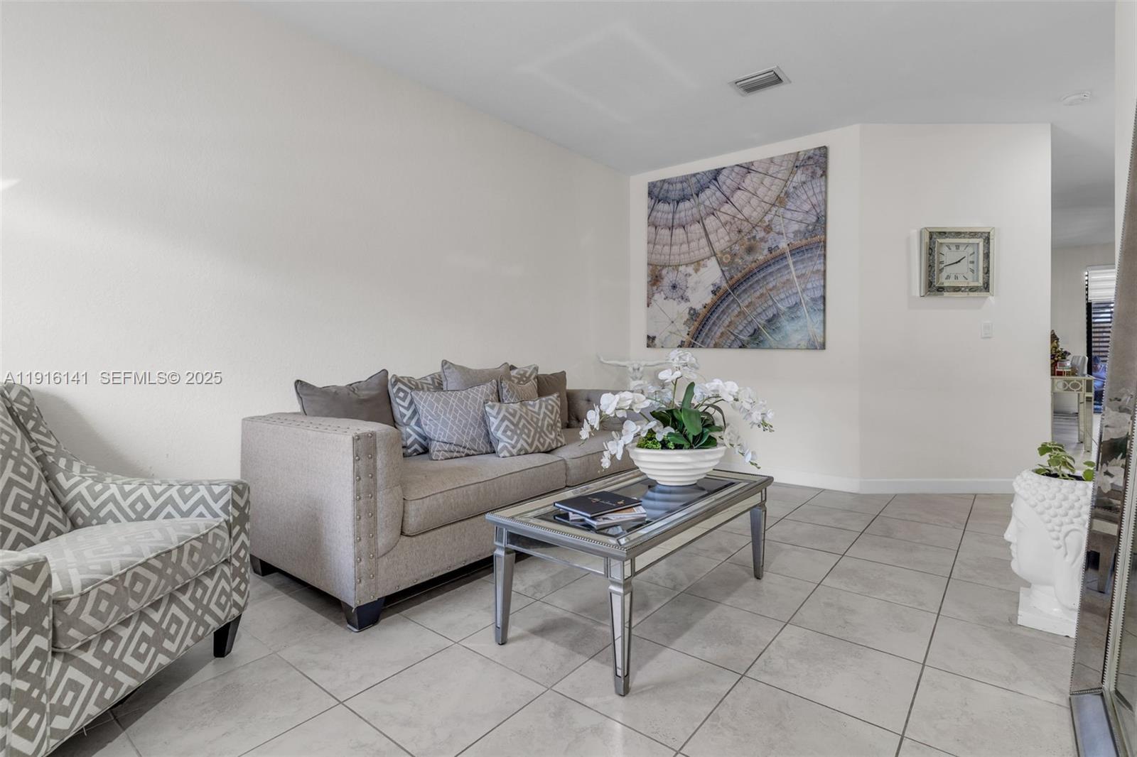 11413 Southwest 252nd Terrace Homestead, FL 33032 - Photo 8 of 40 a living room with furniture and a rug