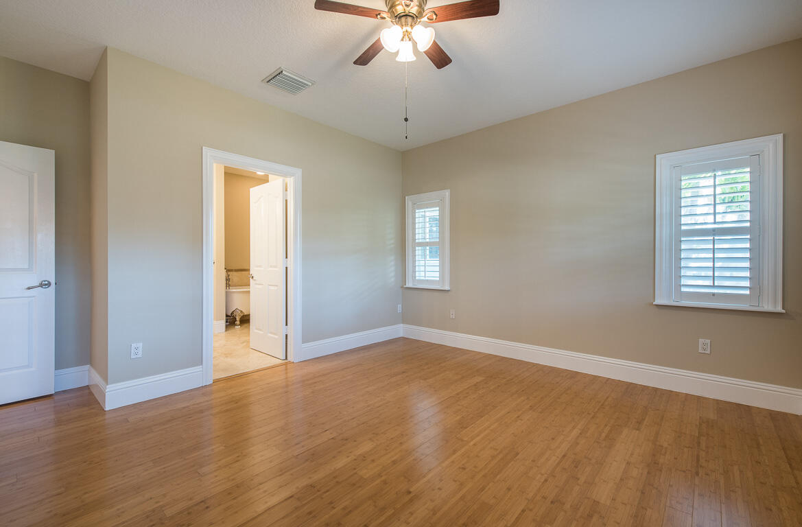 199 Northwest 7th Street Boca Raton, FL 33432 - Photo 11 of 37 wooden floor in an empty room with a window