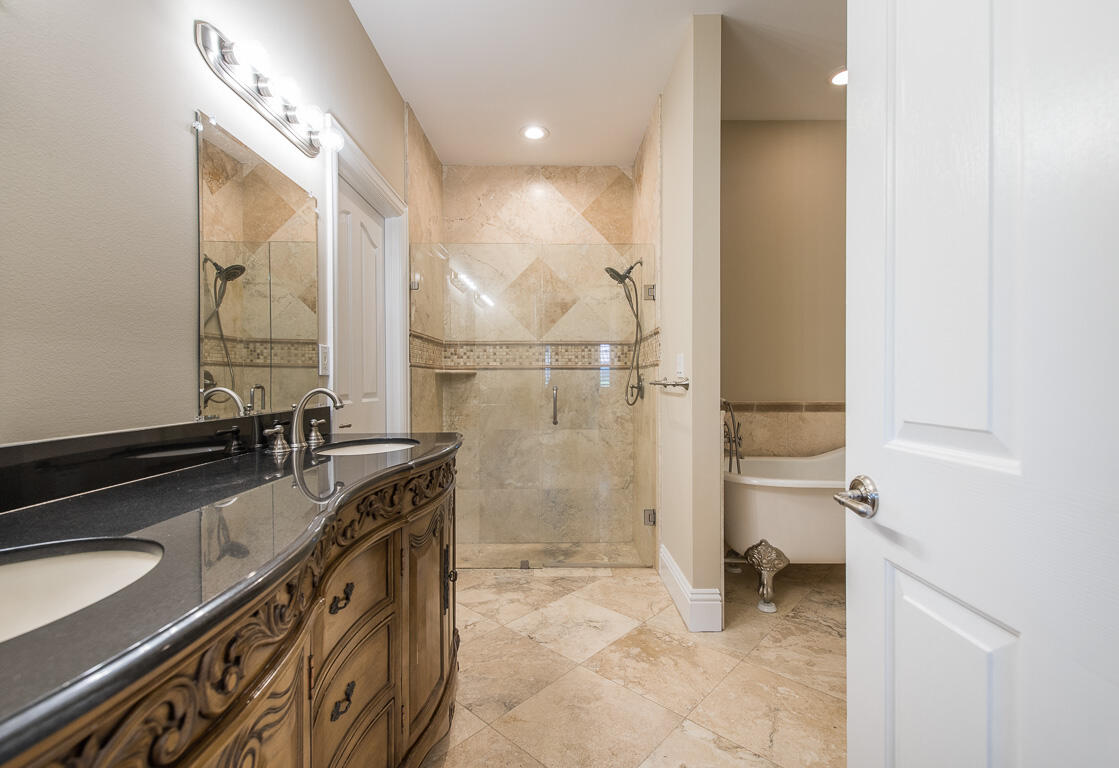 199 Northwest 7th Street Boca Raton, FL 33432 - Photo 14 of 37 a bathroom with a granite countertop sink a toilet and a shower