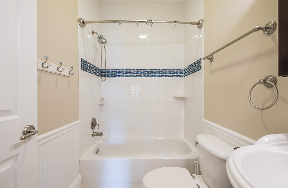 199 Northwest 7th Street Boca Raton, FL 33432 - Photo 22 of 37 a bathroom with a toilet and a bath tub