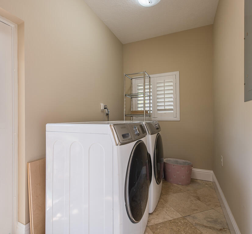 199 Northwest 7th Street Boca Raton, FL 33432 - Photo 24 of 37 a utility room with dryer and washer