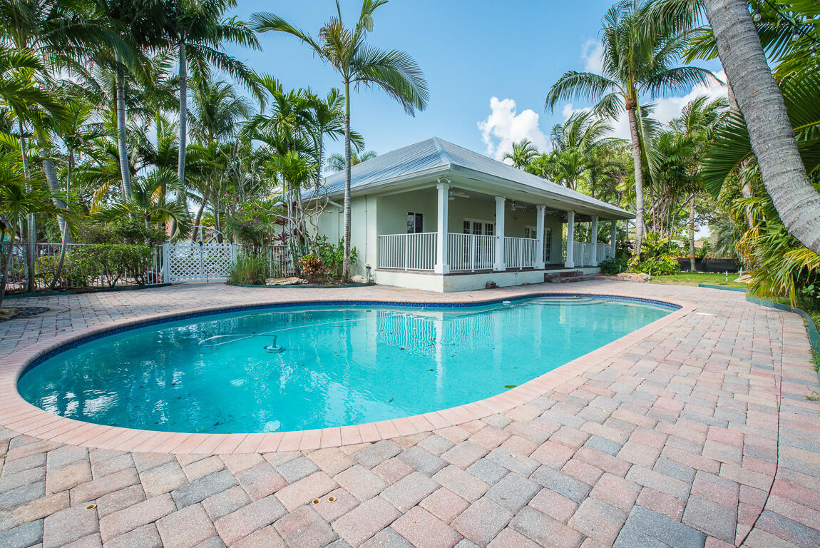 199 Northwest 7th Street Boca Raton, FL 33432 - Photo 27 of 37 a view of a swimming pool with a yard