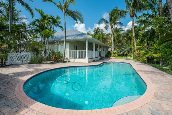 a view of a swimming pool with a patio
