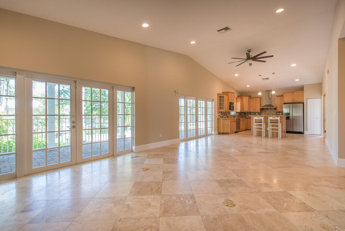 199 Northwest 7th Street Boca Raton, FL 33432 - Photo 3 of 37 a view of an empty room with a kitchen view and a window