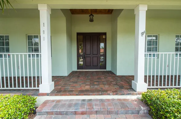 a front view of a house with a porch