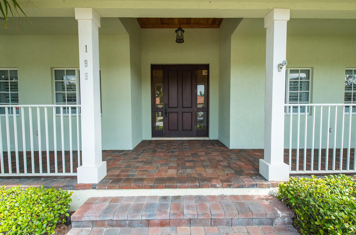 199 Northwest 7th Street Boca Raton, FL 33432 - Photo 32 of 37 a front view of a house with a porch