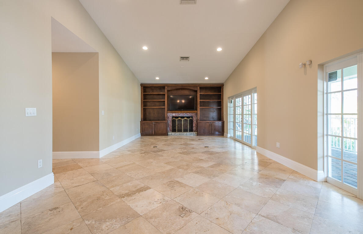 199 Northwest 7th Street Boca Raton, FL 33432 - Photo 5 of 37 a view of an empty room with a window and fireplace