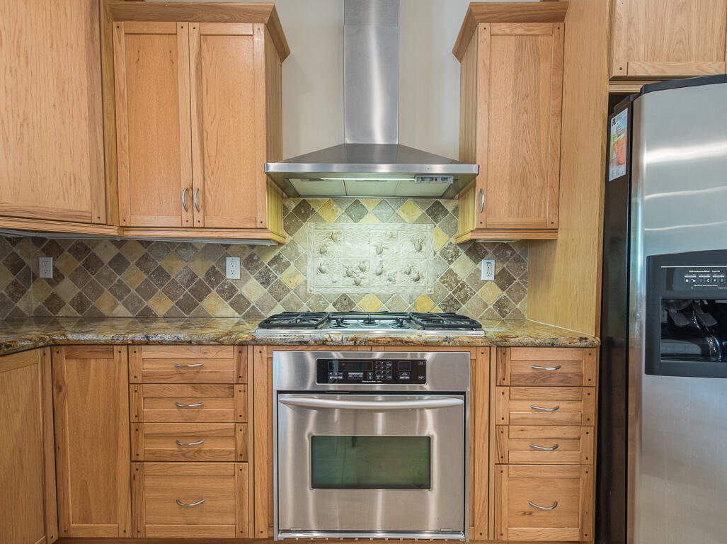 199 Northwest 7th Street Boca Raton, FL 33432 - Photo 9 of 37 a stove top oven sitting inside of a kitchen