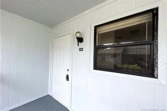 a silver refrigerator freezer and a sitting space