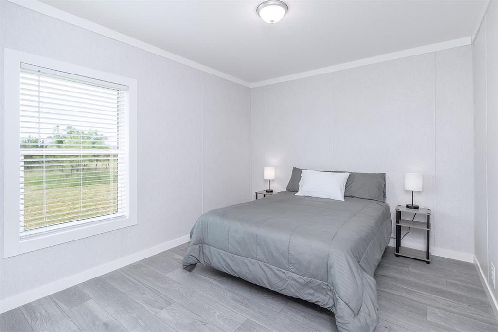 1895 County Road 472 Rochelle, TX 76872 - Photo 22 of 39 a bedroom with a bed and a window