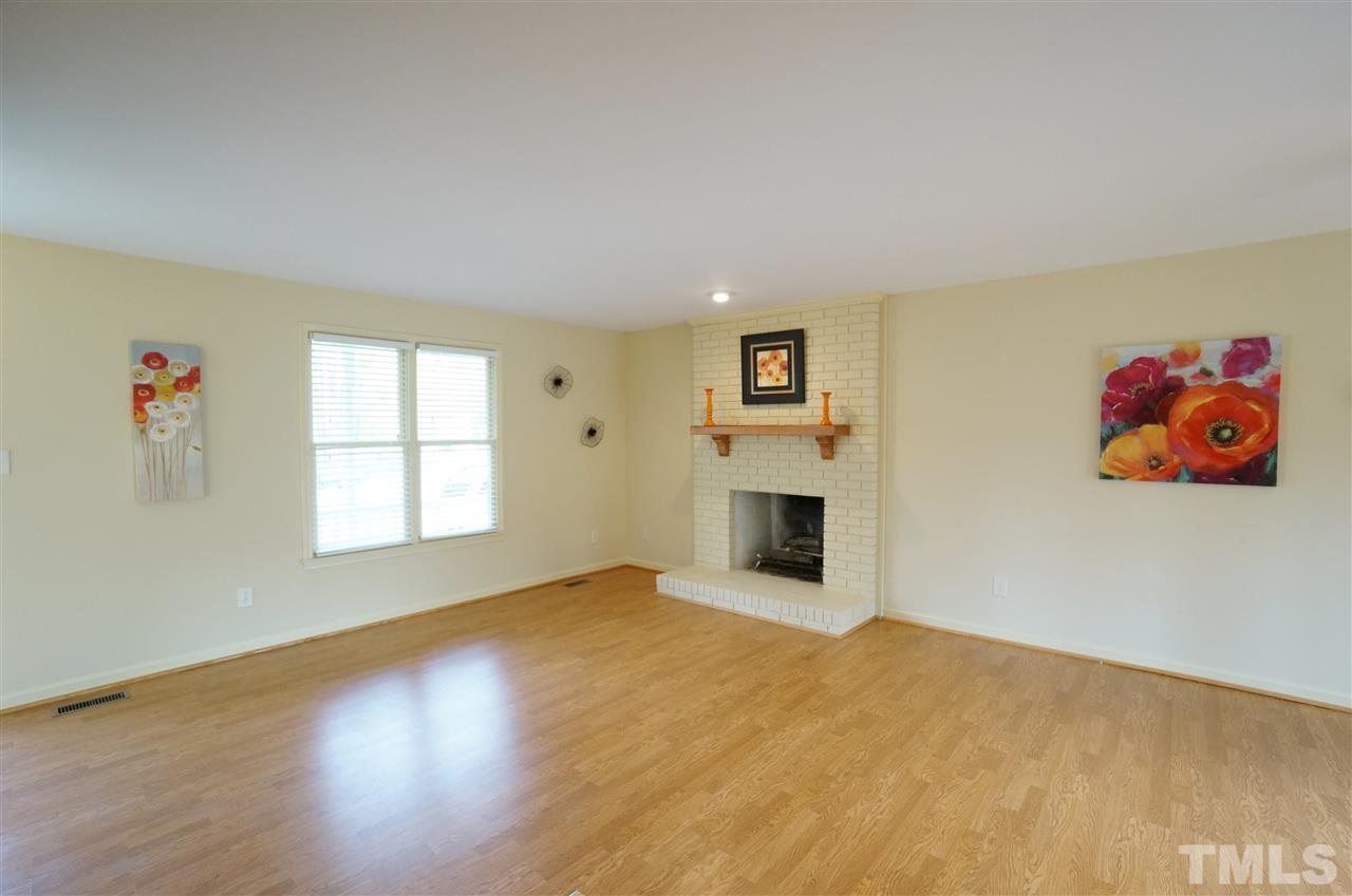 3413 Gemini Drive Raleigh, NC 27604 - Photo 2 of 16 a view of empty room with a fireplace