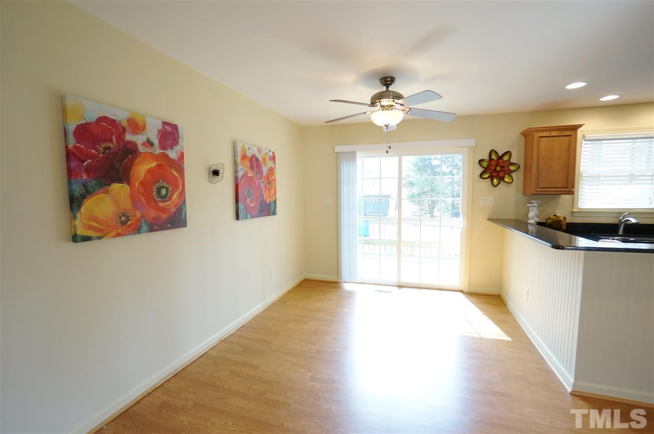 3413 Gemini Drive Raleigh, NC 27604 - Photo 3 of 16 a view of a big room with wooden floor and windows