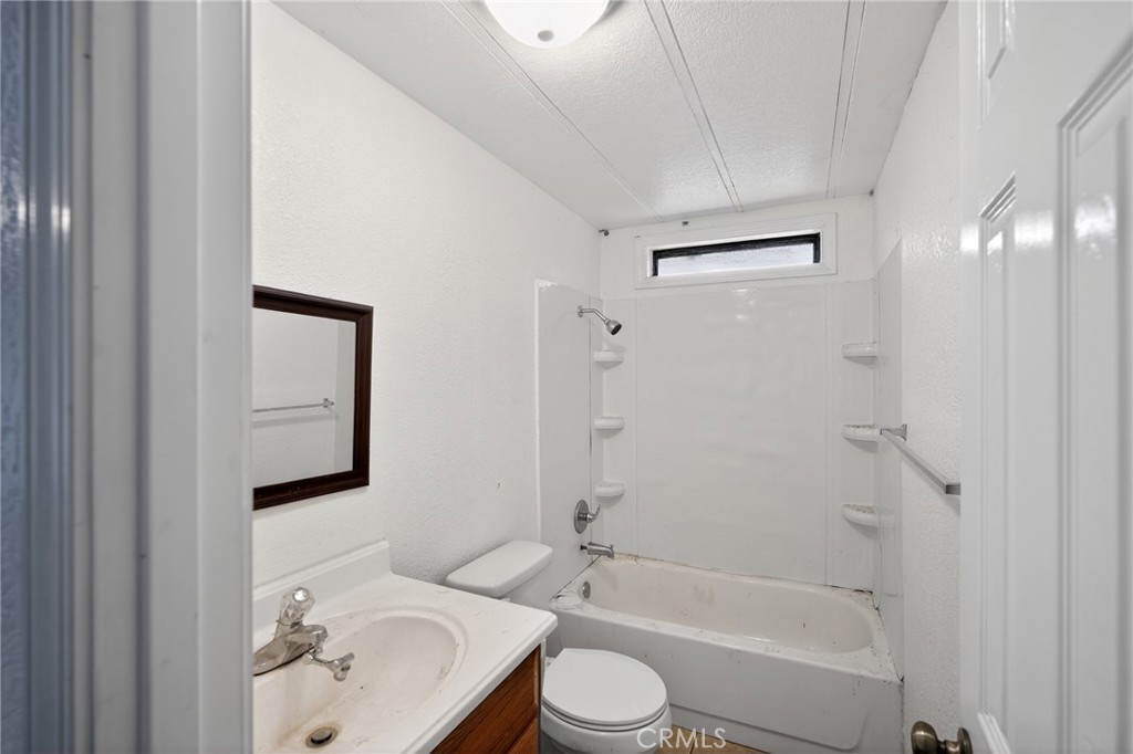 3804 Owl Creek Road Mariposa, CA 95338 - Photo 17 of 18 a bathroom with a bathtub shower sink vanity and toilet