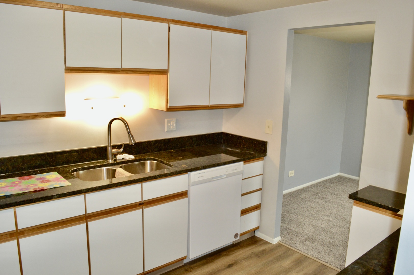 1114 Springinsguth Road, Unit 2C Schaumburg, IL 60193 - Photo 10 of 18 a kitchen with a sink and a window