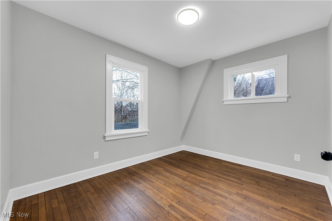 2593 Princeton Road Cleveland, OH 44118 - Photo 28 of 34 Unfurnished room with dark wood-style flooring and baseboards