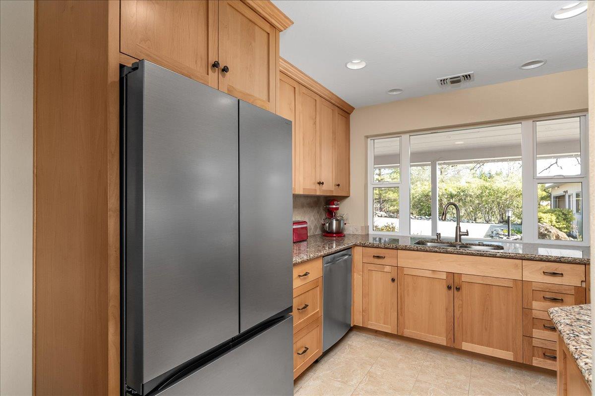 15666 Wolf Mountain Road Grass Valley, CA 95949 - Photo 19 of 78 a kitchen with a sink window and cabinets