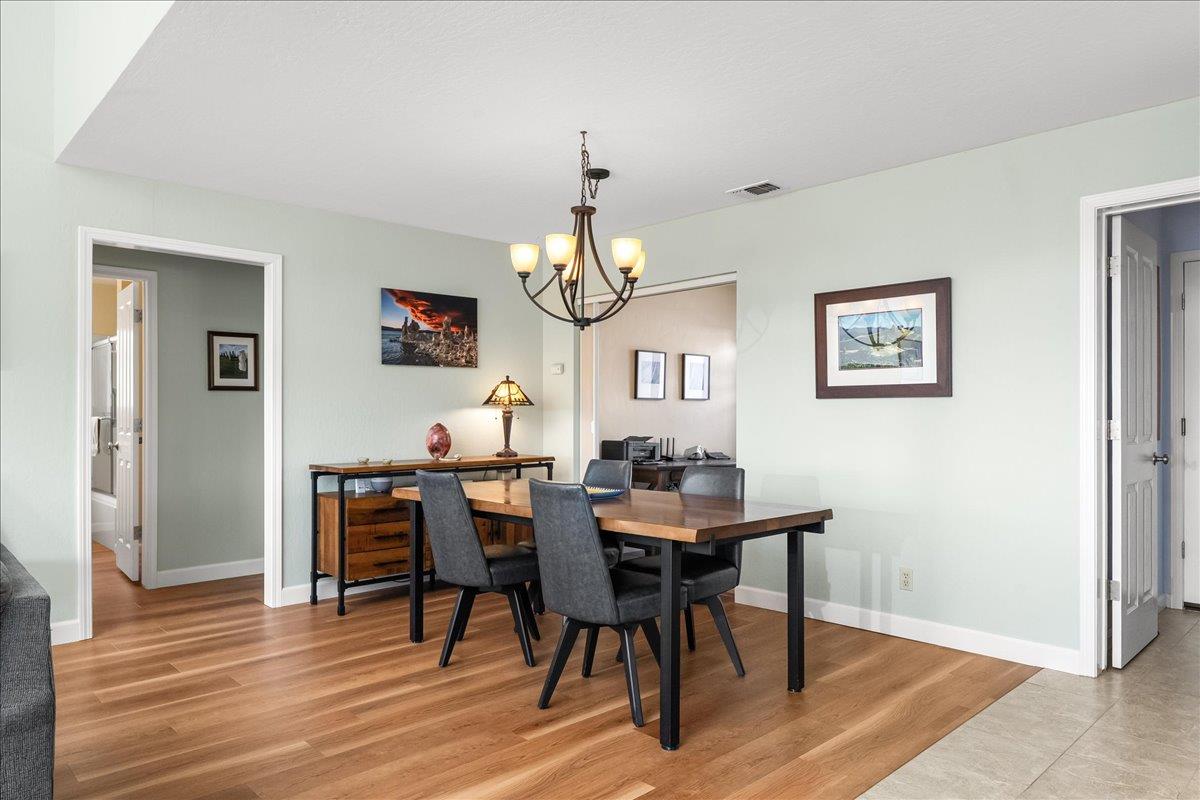 15666 Wolf Mountain Road Grass Valley, CA 95949 - Photo 20 of 78 a view of a dining room with furniture and wooden floor
