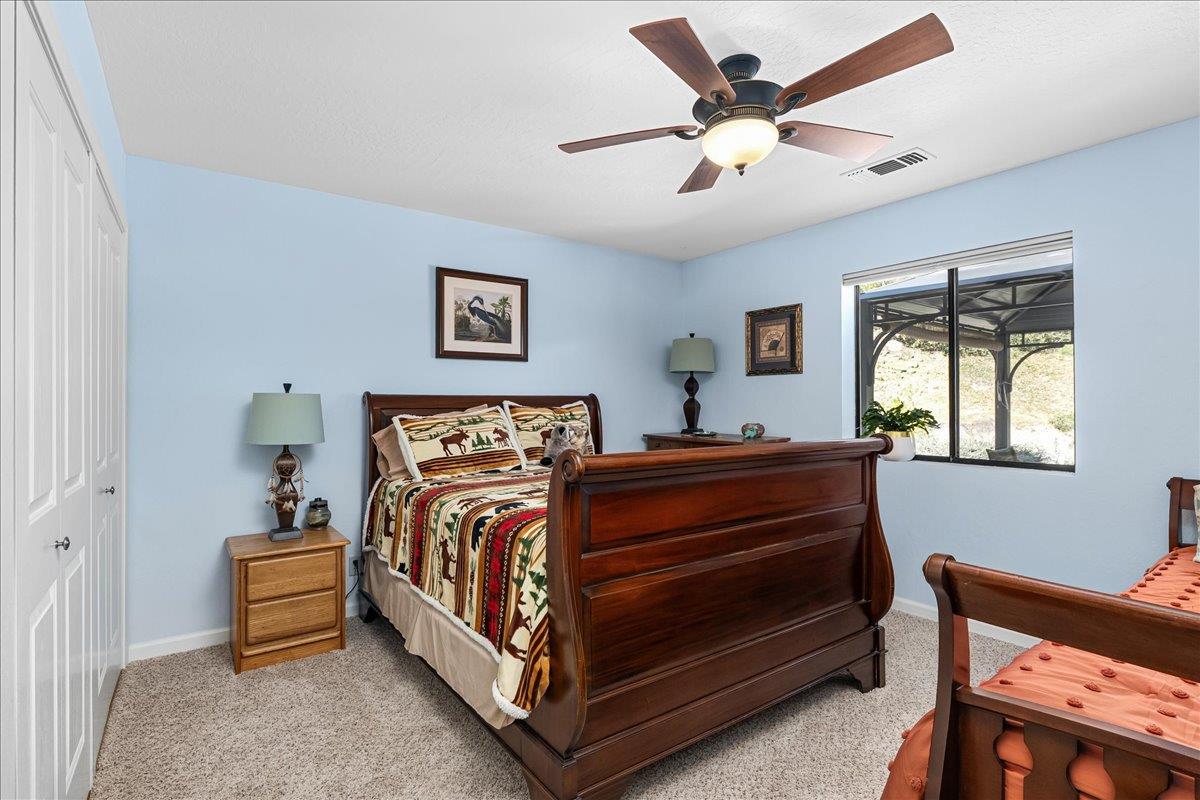 15666 Wolf Mountain Road Grass Valley, CA 95949 - Photo 31 of 78 a bed room with a bed and a window
