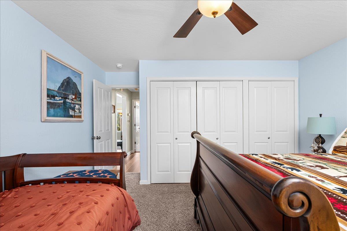 15666 Wolf Mountain Road Grass Valley, CA 95949 - Photo 32 of 78 a bedroom with a bed and a painting on the wall