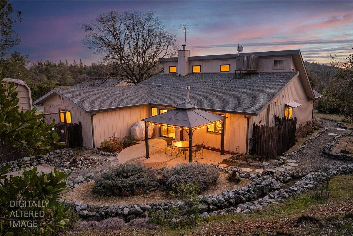 15666 Wolf Mountain Road Grass Valley, CA 95949 - Photo 48 of 78 a view of a house with a yard