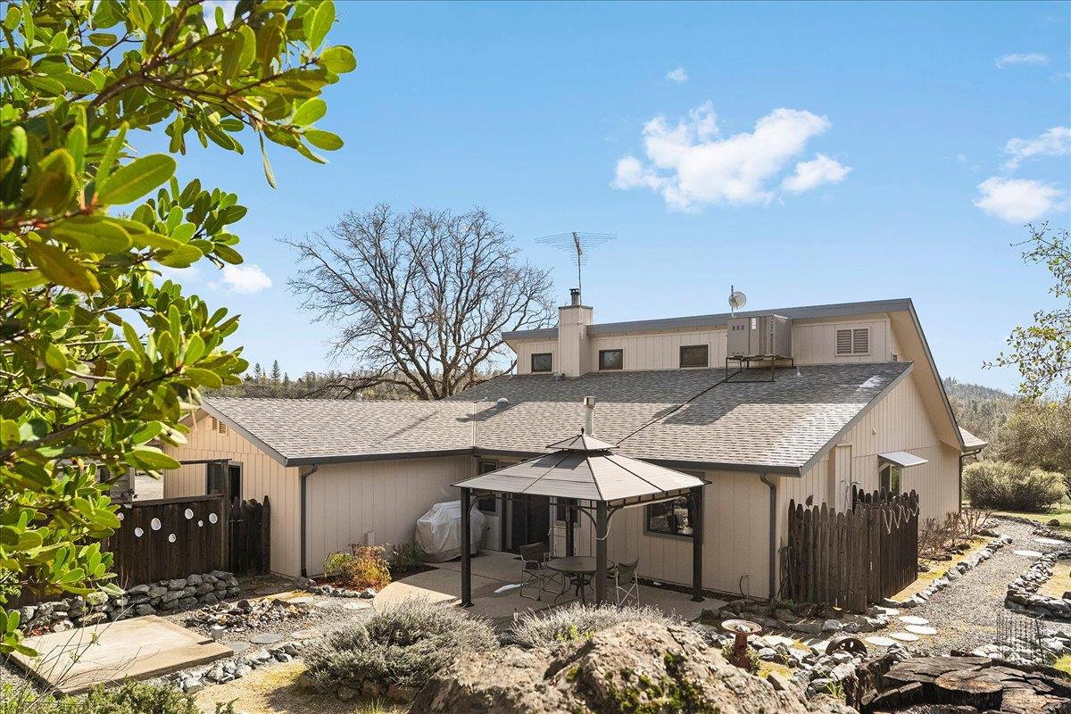 15666 Wolf Mountain Road Grass Valley, CA 95949 - Photo 63 of 78 a view of a house with a yard