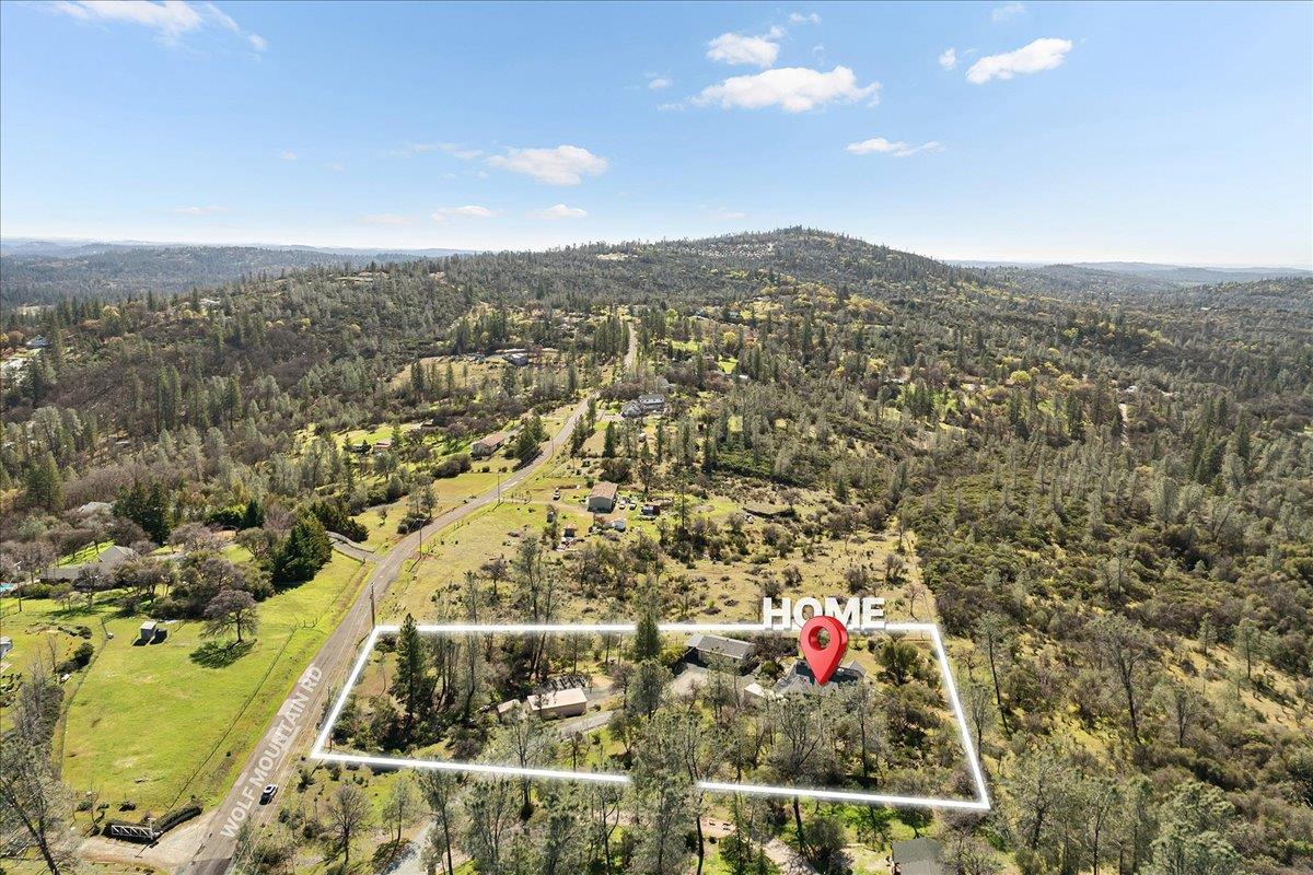 15666 Wolf Mountain Road Grass Valley, CA 95949 - Photo 73 of 78 an aerial view of residential houses with outdoor space and trees