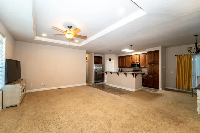 a view of kitchen with furniture and flat screen tv