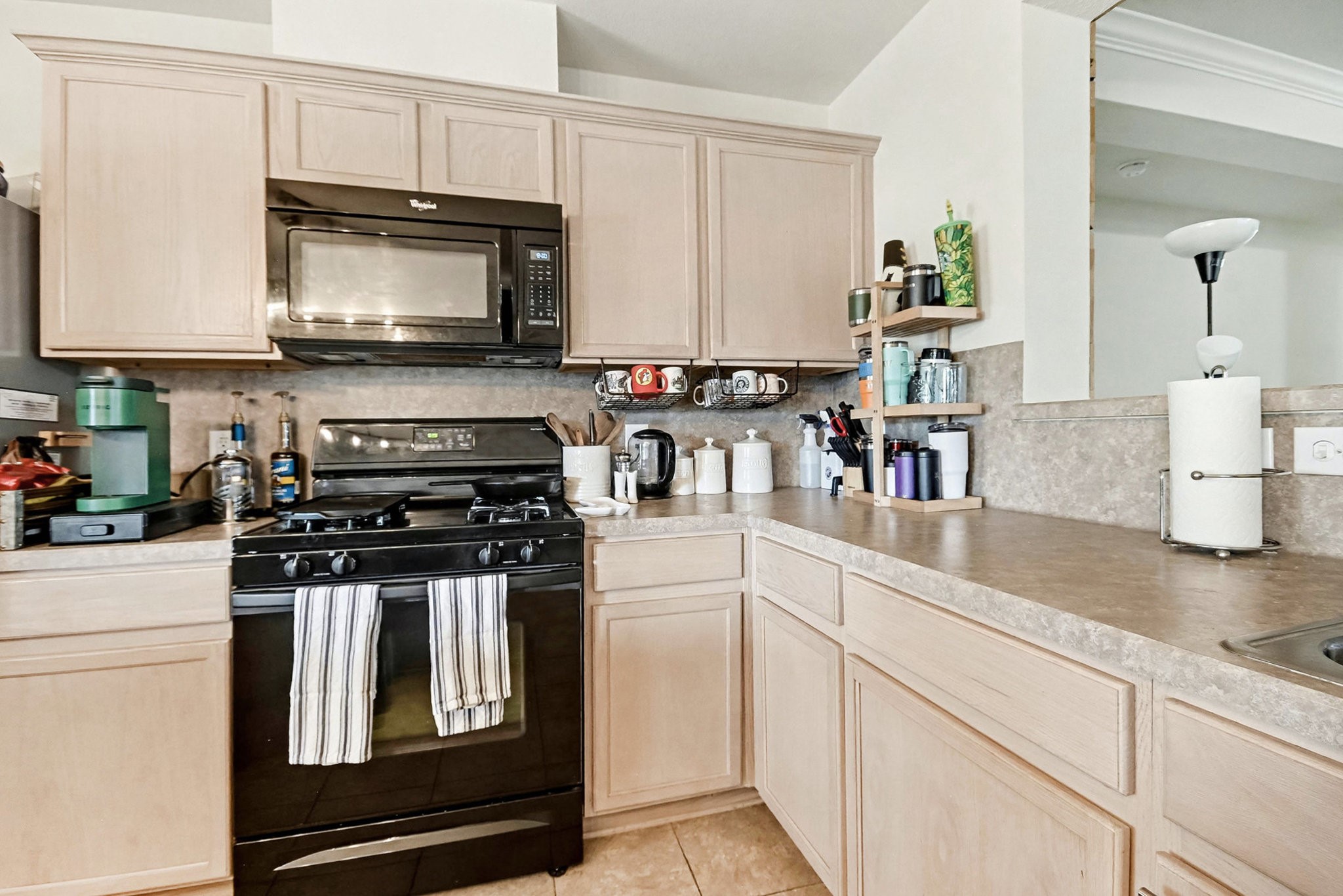 1318 Stevens Court Rosenberg, TX 77471 - Photo 14 of 32 a kitchen with appliances a sink and cabinets
