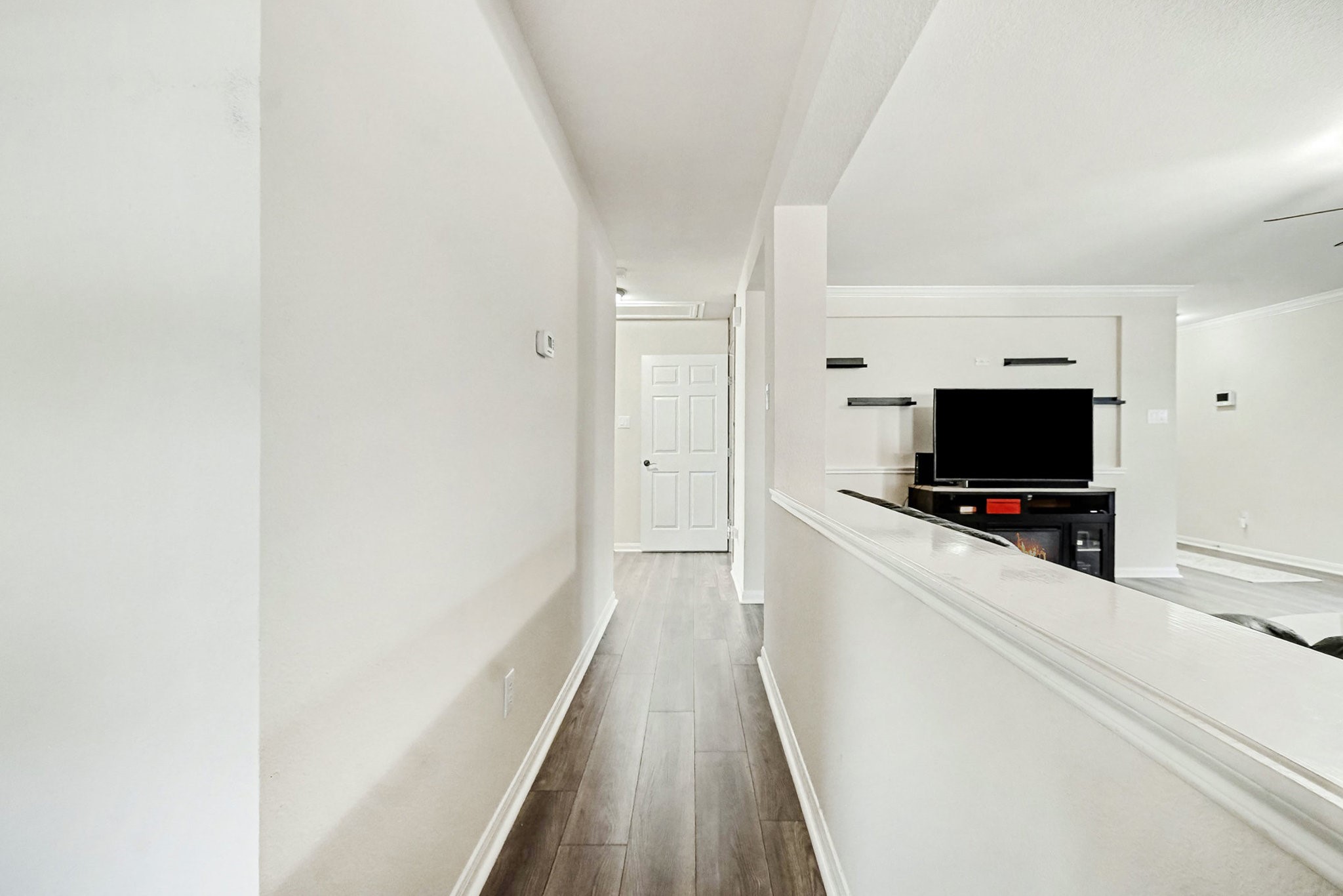 1318 Stevens Court Rosenberg, TX 77471 - Photo 17 of 32 a living room with a flat screen tv and a couch
