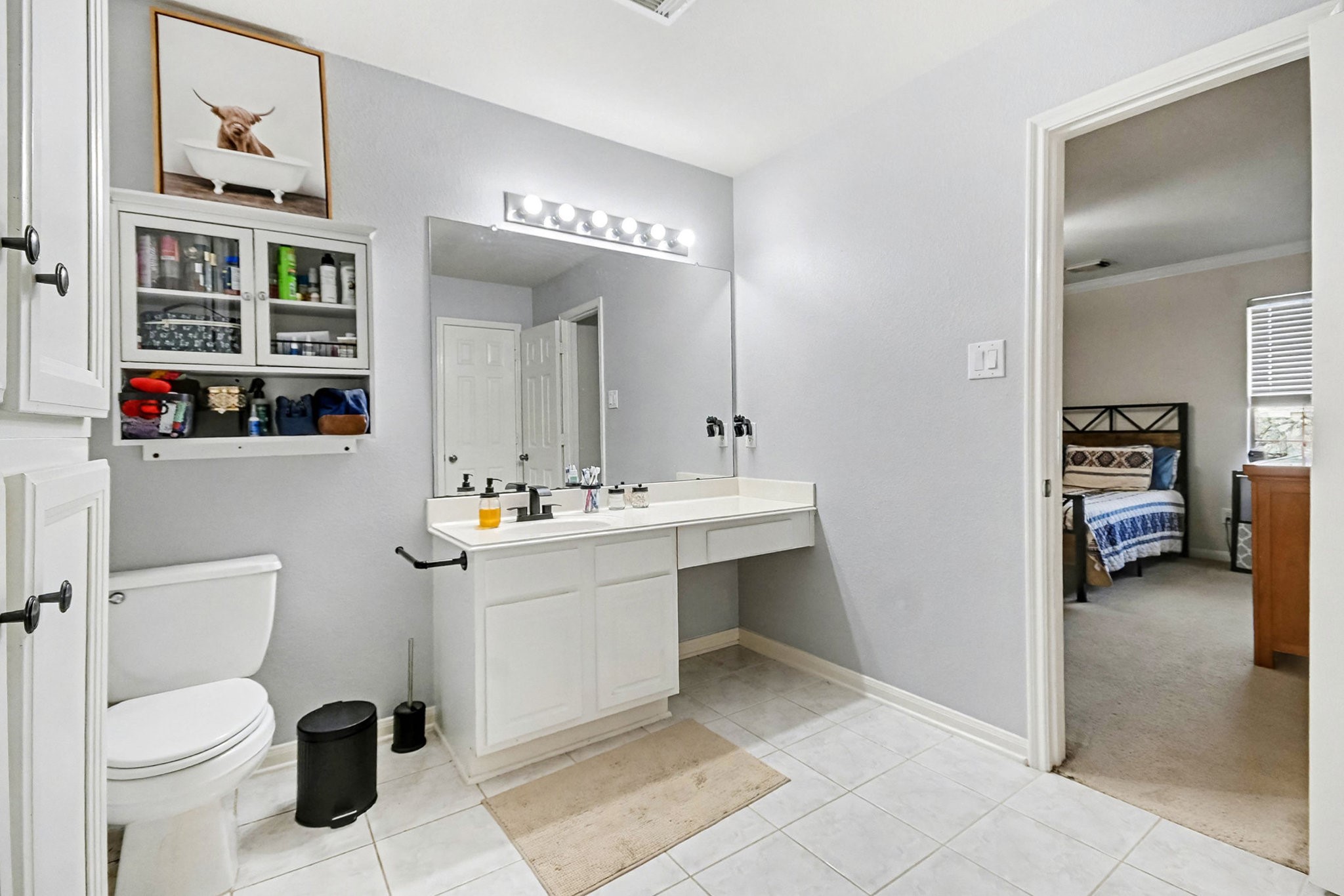 1318 Stevens Court Rosenberg, TX 77471 - Photo 23 of 32 a bathroom with a toilet sink and mirror