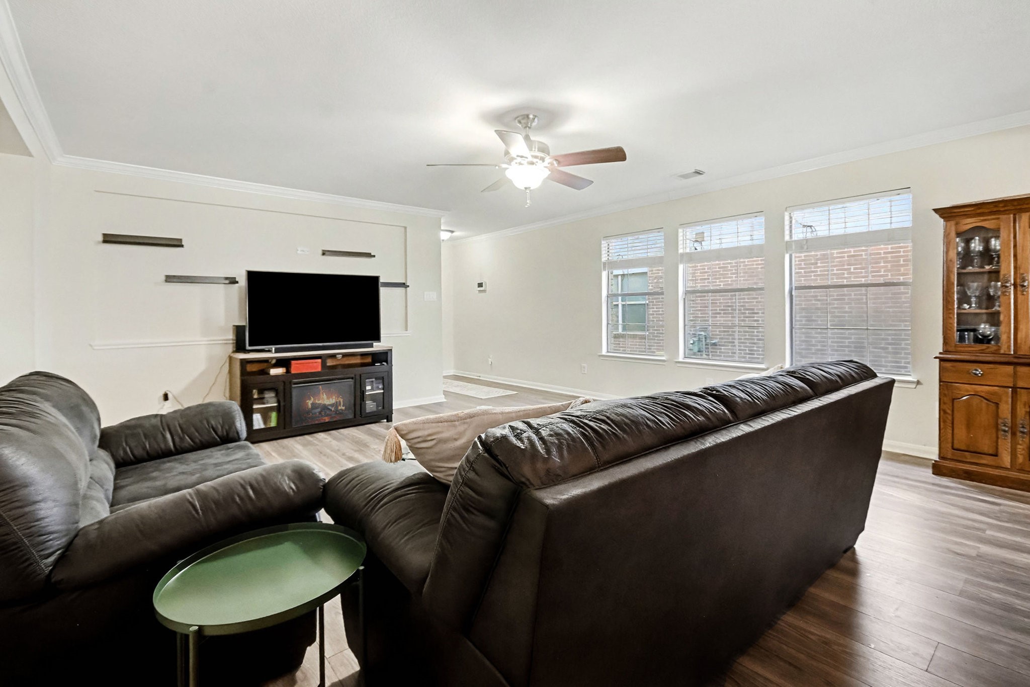 1318 Stevens Court Rosenberg, TX 77471 - Photo 9 of 32 a living room with furniture and a flat screen tv