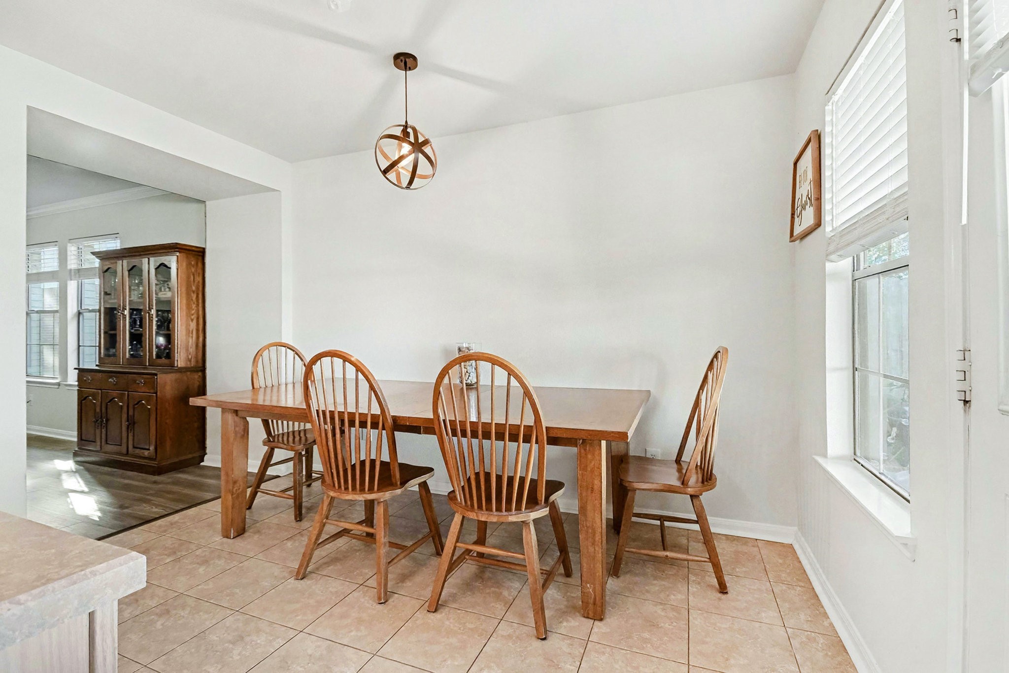 1318 Stevens Court Rosenberg, TX 77471 - Photo 10 of 32 a view of a dining room with furniture window and wooden floor