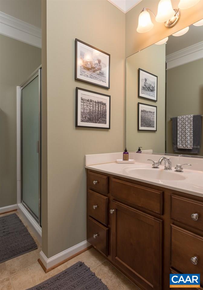 806 Village Road Charlottesville, VA 22903 - Photo 12 of 20 a bathroom with double sink and a mirror