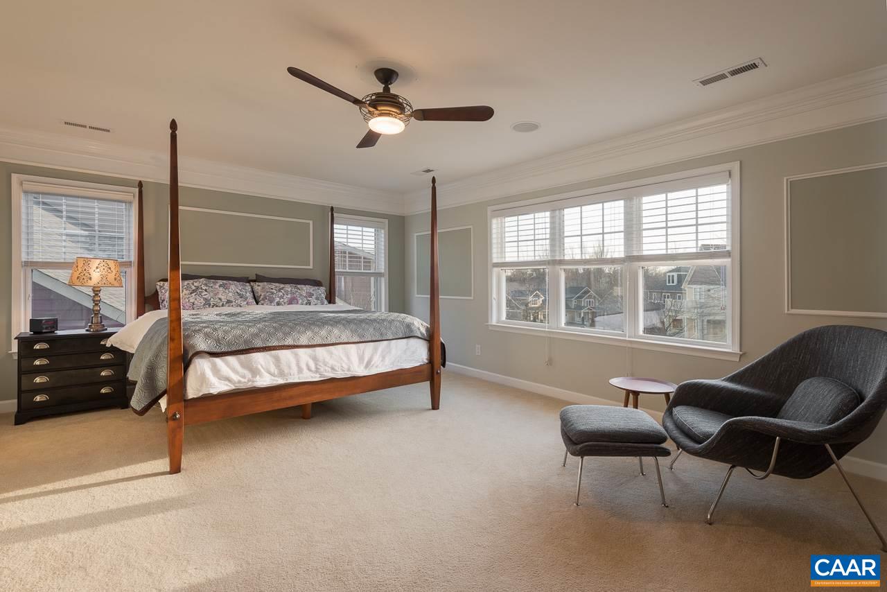 806 Village Road Charlottesville, VA 22903 - Photo 13 of 20 a bedroom with a bed and a couch