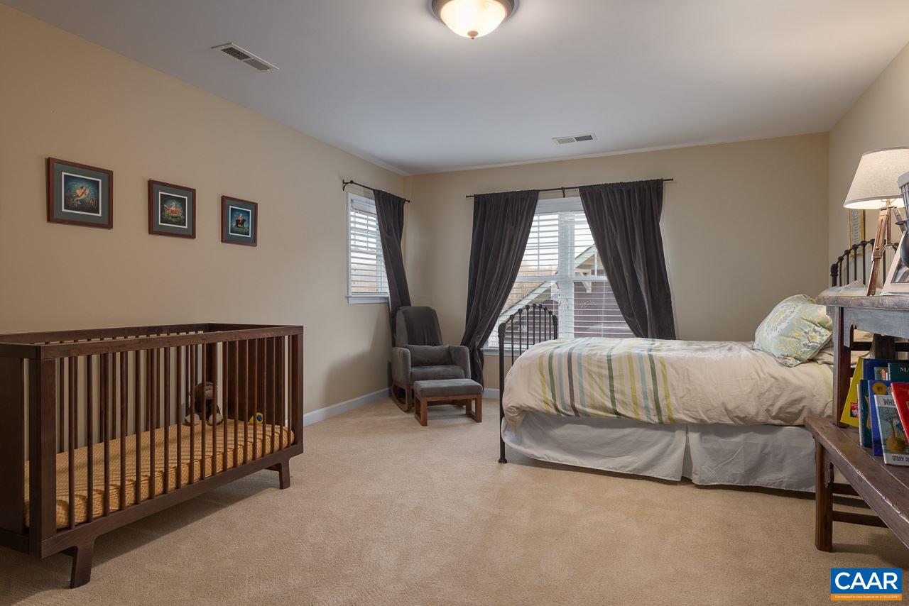 806 Village Road Charlottesville, VA 22903 - Photo 16 of 20 a bedroom with a bed and a window