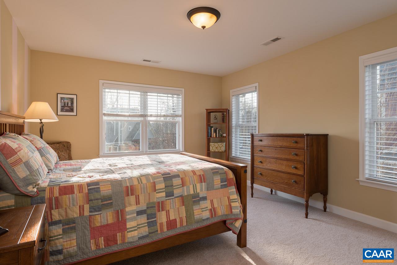 806 Village Road Charlottesville, VA 22903 - Photo 18 of 20 a bedroom with a bed and a window