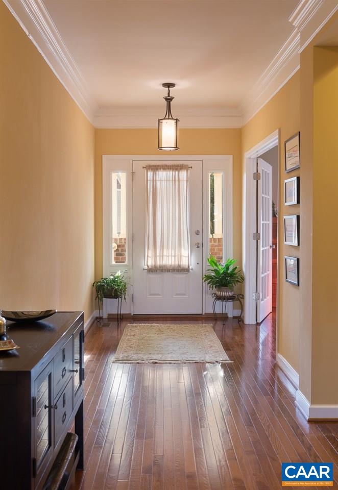806 Village Road Charlottesville, VA 22903 - Photo 4 of 20 a view of an entryway with wooden floors